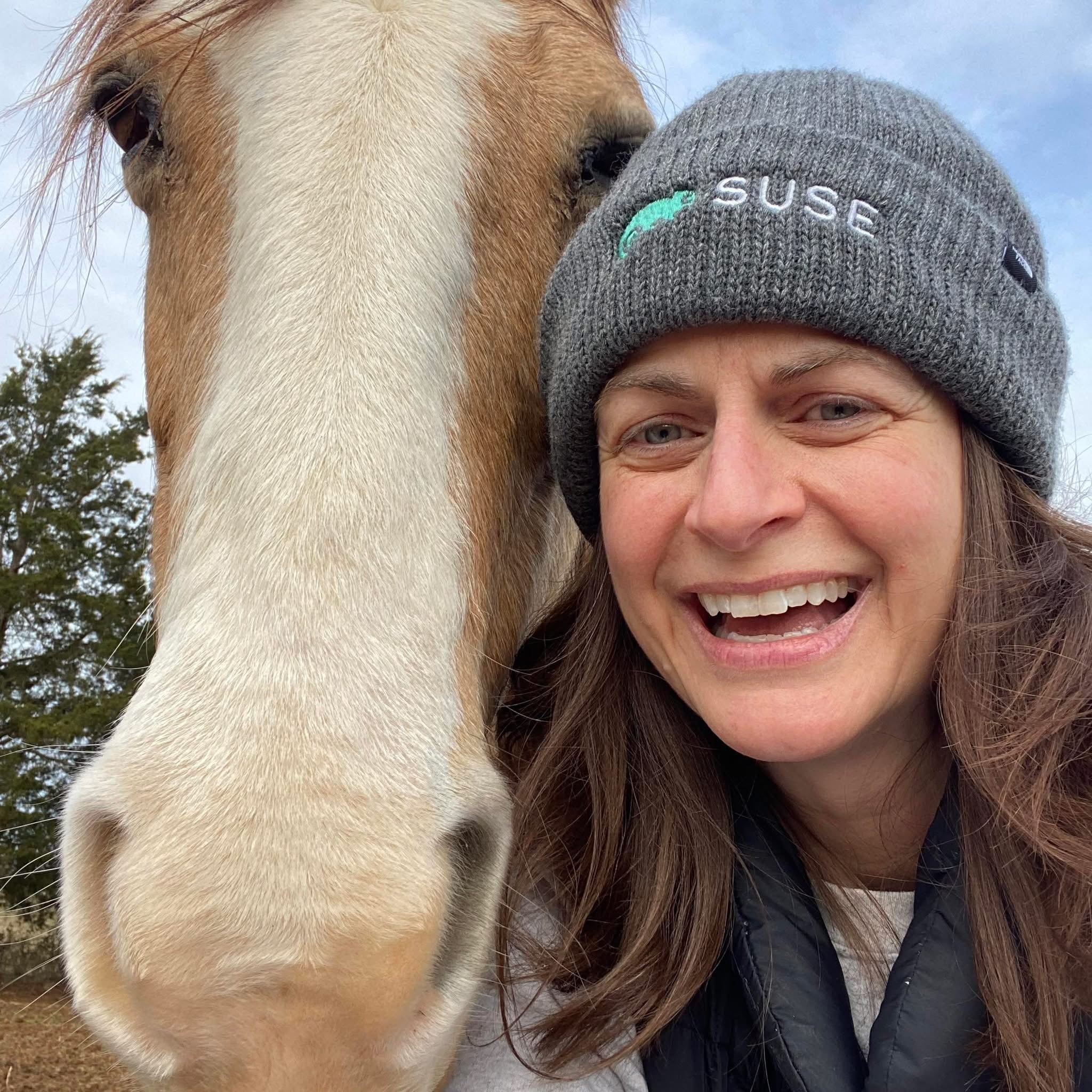 DeeLayne enjoying outdoor freedom with her horse Butter, representing the flexible lifestyle made possible through affiliate digital marketing.”